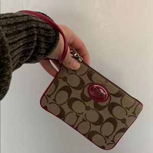 Brown with pink accents Coach wristlet